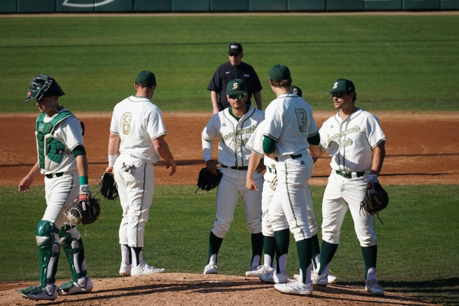 Hornets infielders meet around sophomore pitcher Eli Saul on the mound at John Smith Field Feb. 18, 2022. Saul pitched Friday night to a line of 7.2 innings pitched, zero runs, four hits, and nine strikeouts against Long Beach State. 

