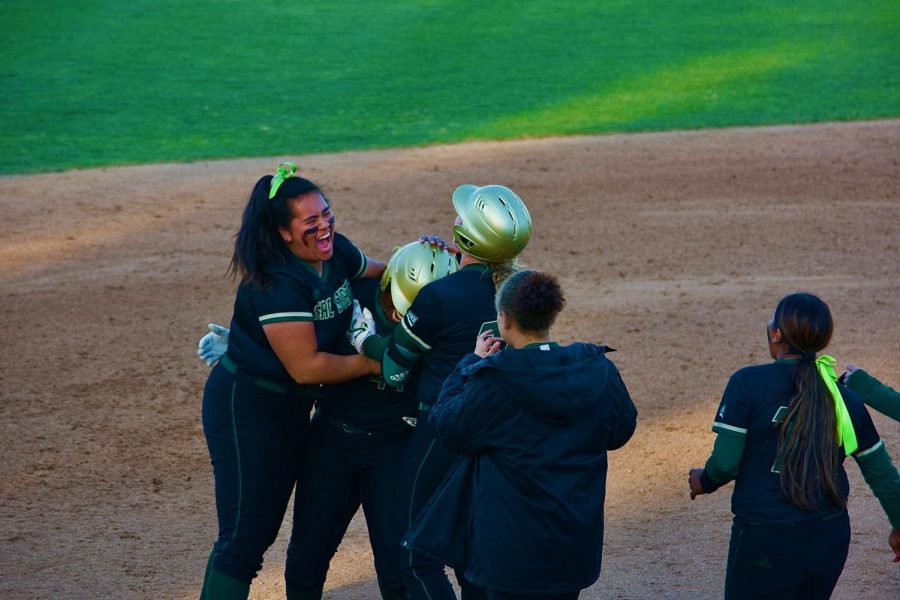 The Hornets mob Lewa Day after she hits a single for a walk-off win against UC Davis at Shea Stadium on March 6, 2022. Day’s walk-off hit sent Hornet fans home happy as they earned their fifth win in a row.