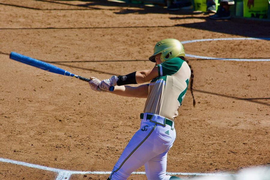 Samantha Parish connects on a single against the University of North Dakota at Shea Stadium on Thursday. Parish went two for six in the Mizuno Classic this past weekend. 