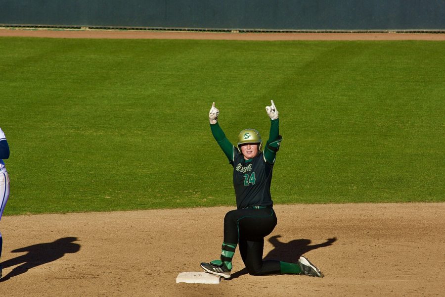  Carley Morfey celebrates on second base against UC Davis on March 6, 2022 at Shea Stadium in the Capital Classic. Morfey had three hits and a double at the Louisville Slugger Invitational this past weekend.