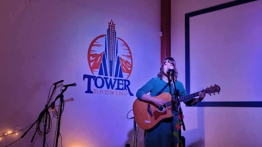 Open mic host Otto Hall welcomes the crowd on Feb. 28 at Tower Brewing. Hall began hosting Monday night open mic nights for the brewery in 2018 and said they were excited about the return of the event.