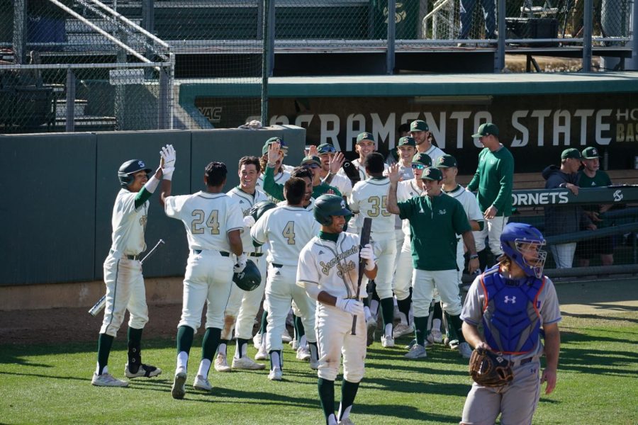 : Sacramento State baseball is all smiles after Cesar Valero’s second home run of the game  Friday, March 4,2022 at John Smith Field.The Hornets earned a 21-4 win over Houston Baptist University and Valero’s ten RBIs set a new school record as he went 5-5 with three home runs.
