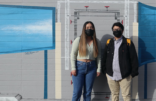 Aiyana Garcia, a civil engineering major, (left), and Alyssa Rendon, a computer engineering major, (right) stand in front of the computer science and engineering mural at Santa Clara Hall on March 2, 2022. Garcia and Rendon said they hope to reduce the gap in the numbers of men and women in the engineering field. (Photo by Alexis Perales)
