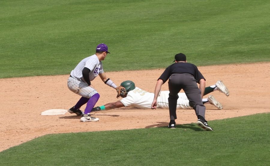 Freshman outfielder Jeffrey Heard slides into second base safely after being picked off by Grand Canyon University pitching on March 27 at John Smith Field in a 3-2 loss for Sac State. Heard is hitting .257 with three homers and six RBIs on the year.