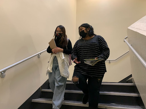 Wendy Le, a third year computer science major (left), and Elisha Singh, a first year psychology major (right) walk down the stairs of the Student Union, on Thursday, March 10. Sacramento State President Robert S. Nelsen announced via mass email to students that masks can come down beginning Friday, March 18. (Photo by Kamelia Varasteh)
