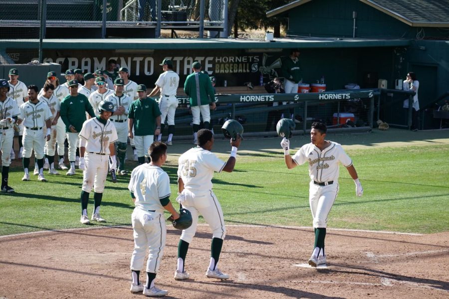 %28FILE+PHOTO%29+Sophomore+Cesar+Valero+celebrates+a+home+run+with+his+teammates+at+John+Smith+Field+Sunday%2C+March+27%2C+2022+against+Grand+Canyon+University.+Valero+tallied+four+home+runs+over+the+weekend+and+now+leads+the+WAC+with+12+this+season.+%0A%0A