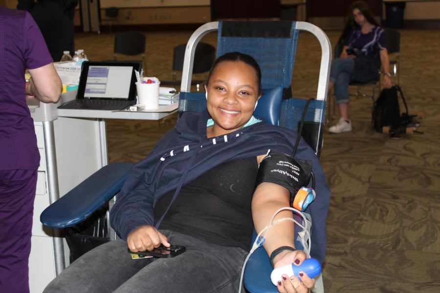Adia Hayes, a sophomore environmental studies major, prepares to have a nurse draw her blood on Tuesday, April 19, 2022. Participants were encouraged to donate blood and join the “Be The Match” marrow registry to double their donation. 
