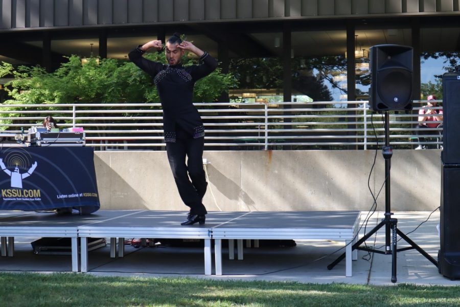 Andrew Cervantes from the Yemaya Salsa Dance Company performing at the Multi-Cultural Fair in the Housing Quad on Tuesday, April 5, 2022. Cervantes said Yamaya hosts Salsa & Bachata at Mango’s on K Street every Wednesday. (Photo by Dominique Williams)