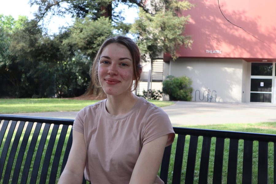 Lead actress McKenna Sennett sits on a bench in front of Shasta Hall theater on Thursday, April 7, 2022. Sac State’s production of “Hamlet” runs from April 1 to April 10 and can be attended in the theater.