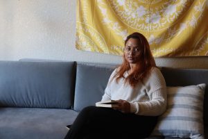 Roza Mahzabin, a psychology major at Sac State, sits inside her dorm at American River Courtyard on Thursday, March 17, 2022. Mahzabin moved from Los Angeles to attend Sacramento State and said she had to turn to Facebook to find housing for next semester. 
