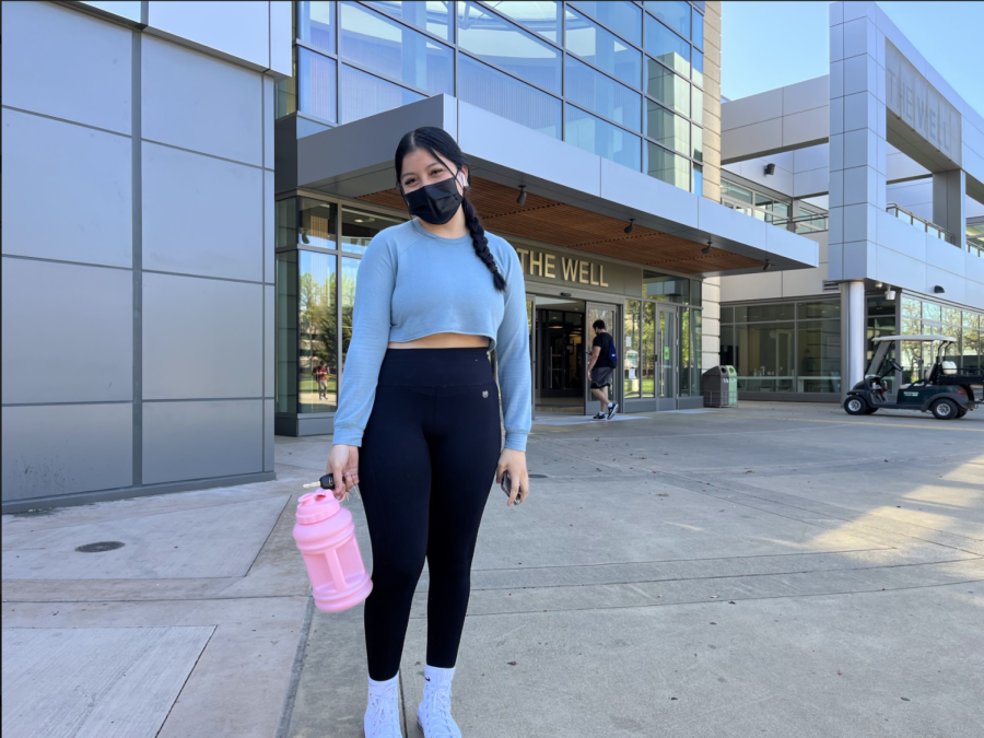 Alejandra Santiago, a second-year child development major stands outside the WELL before heading in for her workout on March 17, 2022. Santiago said  she was having trouble making a reservation through the app which made it difficult to enter the facility.