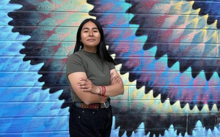 Rosalba Gomez-Bautista, second year political science major and ethnic studies minor poses in front of the mural on the Studio Theater on Tuesday, April 12, 2022. “We don’t want to be generalized as just Mexicans, we deserve to be represented and it’s very empowering especially now to be Indigenous and to claim that identity,” Gomez-Bautista said. (Photo by Hannah Asuncion)
