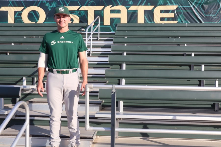Dawson Bacho posing in the bleachers at the Sac State baseball field. Bacho is set to graduate this spring after a tremendous career at Sac State.