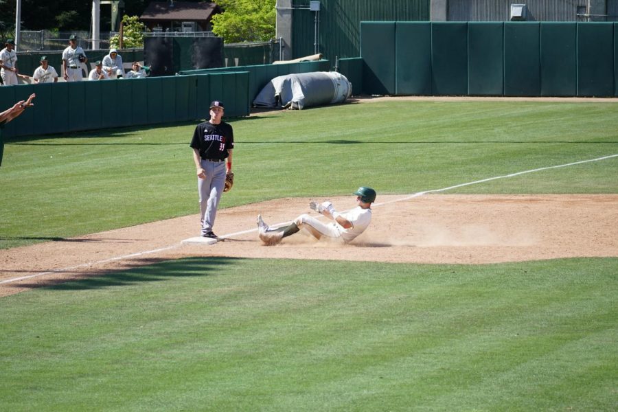 Dawson Bacho slides safely into base during a game against Seattle University. The Hornets played the Redhawks in a three-game series in Sacramento from Apr.15-17. 