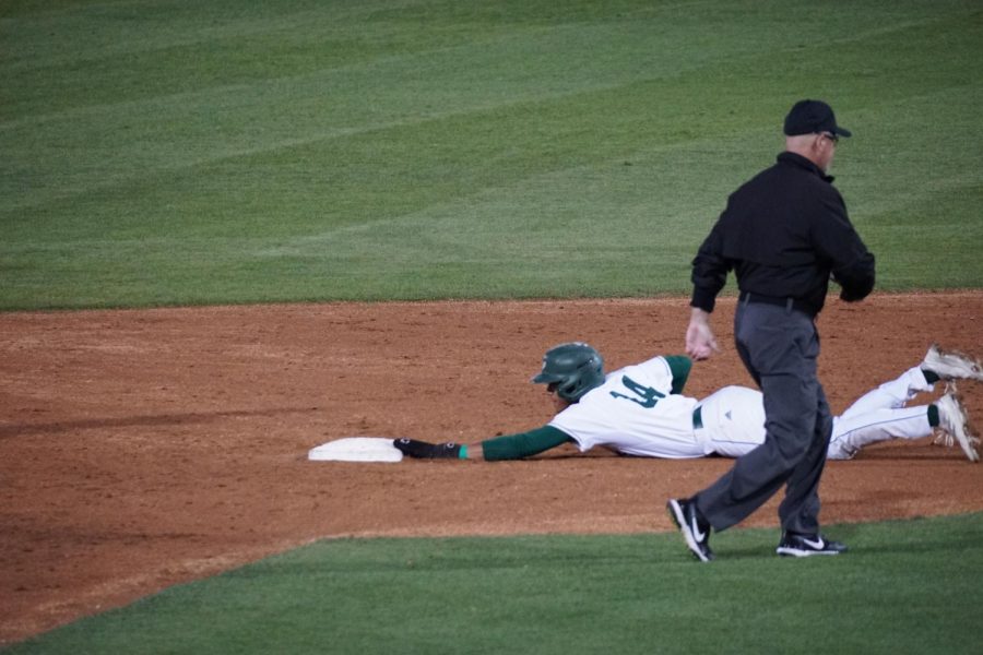 Sophomore Cesar Valero dives into second base at John Smith Field on Tuesday, March 29, 2022 in a 5-2 loss to University of the Pacific. Valero has 38 runs batted in in 39 games played.
