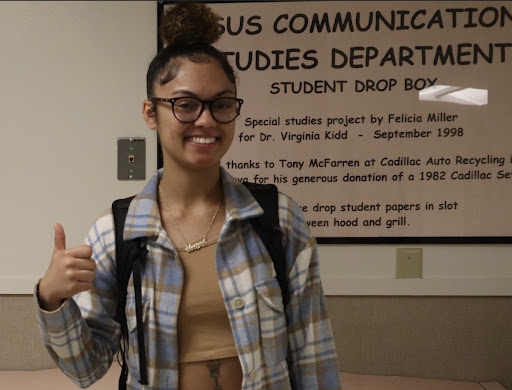 Imani Marshall, third year communications major,  poses with her thumb up before walking into her communications professor’s office for help in her class on May 3, 2022. “This is my first semester in the major and all my professors have been really nice,” Marshall said.
