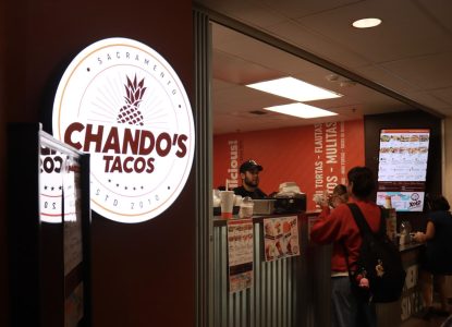 Chando’s employees serve students their orders on Thursday, Sept.16, 2022. The local taco chain is quickly becoming a staple at Sac State with daily deals on menu items and positive reviews from students.