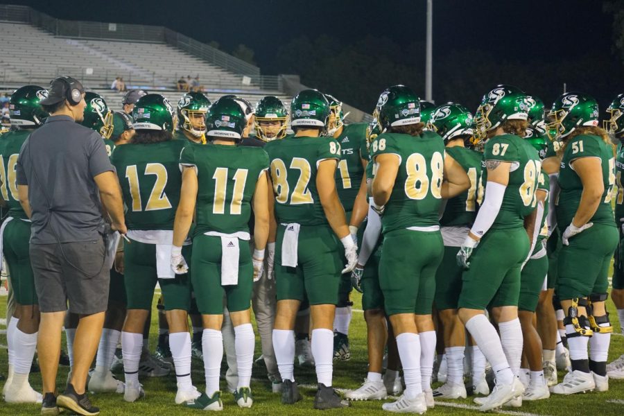 The Sac State football team huddled during a timeout against Utah Tech Saturday, Sept. 3, 2022 at Hornet Stadium. The Hornets cruised to a 56-33 win over the Trail Blazers behind the play of Senior quarterback Asher O’Hara and sophomore running back Cameron Skattebo, who helped the Hornets combine for over 350 rushing yards. 
