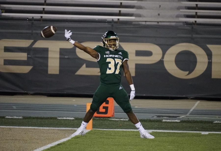 Junior Sac State Cornerback Dillon Juniel flips the ball in celebration after picking off a Utah Tech pass for the Hornets third interception in the first quarter Saturday, Sept. 3, 2022, against the Trail Blazers at Hornet Stadium. The Hornets started their season off 1-0 after their 56-33 win against Utah Tech Saturday.
