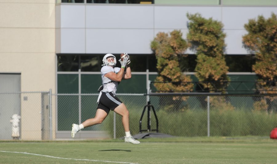 Sac State sophomore long snapper Austin Jarrard making a behind-the-back snatch during practice Wednesday, Aug.31, 2022, at the Sac State practice field.  The Sac State football team starts the year off with a week one matchup against Utah Tech at Hornet Stadium at 7:30 p.m PST.