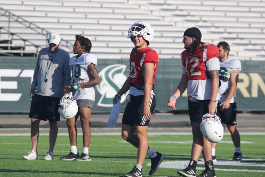 Senior quarterbacks Asher O’Hara and Jake Dunniway stroll through practice on Wednesday, Sept. 14, 2022 at the Hornet practice field. O’Hara and Dunniway helm an offense ranked fifth in the nation in points per game, averaging 46.5.