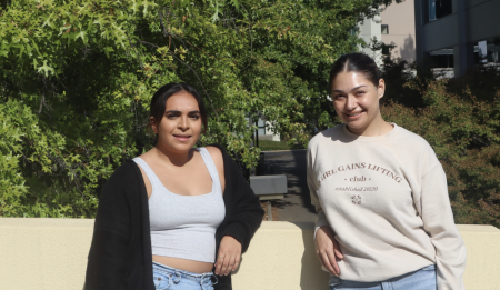 Fourth-year exercise science major Natallie Melgoza (left) and  fourth-year pre-medicine major Paola Garcia (right) pose by the Sac State library on Sept. 20, 2022. The two women are the founders of the Girl Gains chapter at Sac State.
