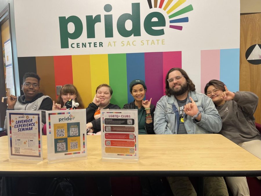 Pride+Center+coordinator+Tranh+Pham+%28middle+right%29+and+other+students+at+the+Pride+Center+on+Tuesday%2C+Sept+20%2C+2022.+%E2%80%9CIm+really+grateful+that+I+am+privileged+to+have+amazing+staff+and+volunteers+and+community+members+in+the+pride+center+who+are+adding+to+the+collective+wisdom+and+experience+other+students+get+to+have%2C%E2%80%9D+Pham+said.