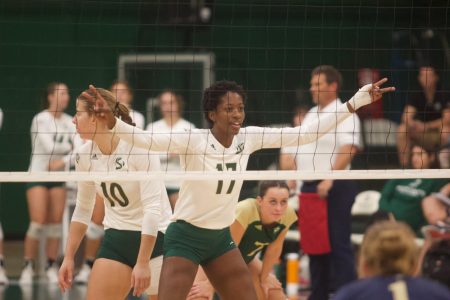 [FILE] Sac State senior middle blocker Tiyanane Kamba-Griffin signaling team to get ready as she prepares for a possible block. Kamba-Griffin had three kills and three blocks against Portland State on Saturday Oct. 23, 2022.
