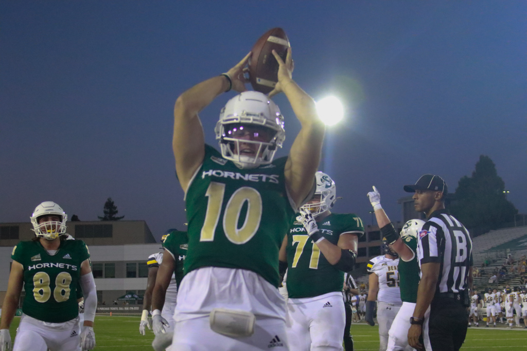 Senior Sac State quarterback Asher O’Hara spikes the ball after a touchdown in the Hornets’ 55-7 win over Northern Colorado Saturday, Oct. 8, 2022, at Hornet Stadium. O’Hara finished with 11 rushes for 57 yards and the rushing touchdown.