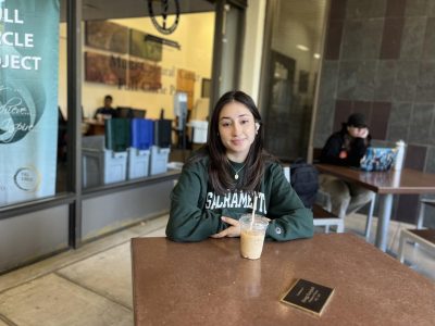 Second-year health science major Carolina Garcia sits in front of the Multi-Cultural Center on Tuesday, Oct. 25, 2022. She hopes to see Sac State add another reuse program for the Hornets to utilize.