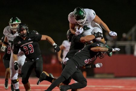 Cameron Skattebo attempts to leap over an Eastern Washington defender on Roos Field, Saturday Oct. 15, 2022. Skattebo put up a career high 201 rushing yards against the Eagles helping the Hornets to a 6-0 record.