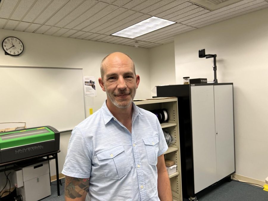Preston Tobery, the StingerStudio makerspace coordinator poses in front of a 3D printer on Oct. 6, 2022. Tobery has led other makerspaces in the past and is looking to expand this one in the near future.