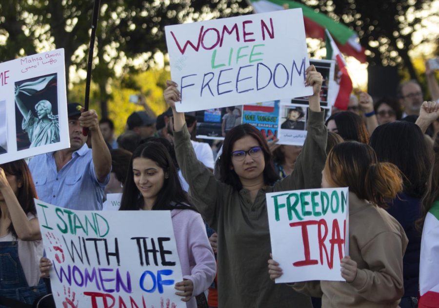 Protesters gather outside the Westfield Galleria in Roseville on Oct. 9, 2022. They were chanting “down with dictator,” and “say her name, Mahsa Amini,” to raise awareness of the protests in Iran following the death of a 22-year-old woman in the country.