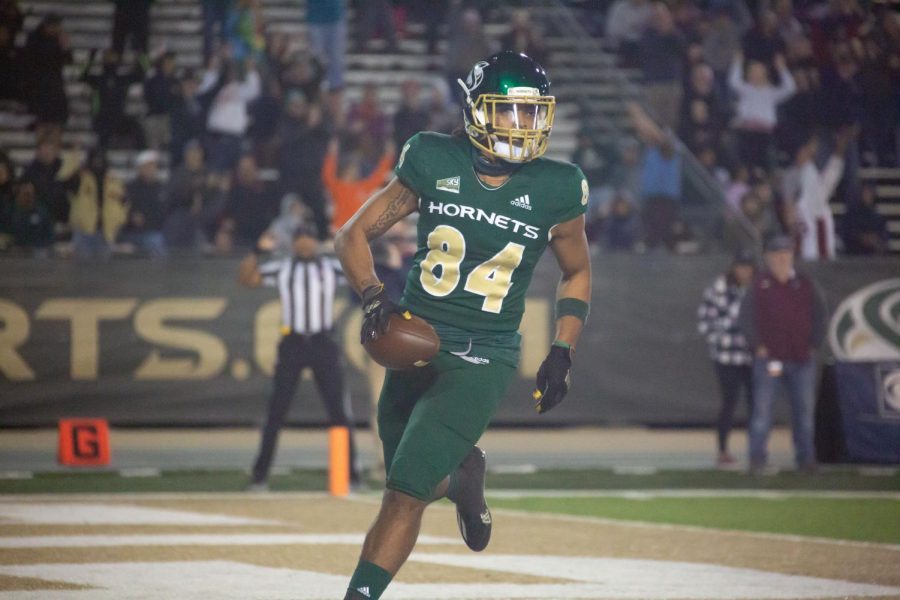 Senior wideout Pierre Williams finishes his 45-yard touchdown run, making the score 14-17 in Hornet Stadium on Saturday, Oct. 23, 2022. Williams ended with three catches for 68 yards and this touchdown. 

