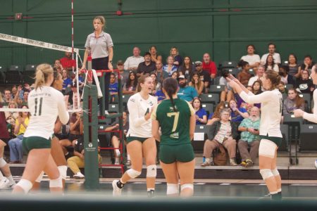 [FILE] Sacramento State volleyball players embrace after a point on Thursday, Oct. 6 2022, against Montana at The Nest. The Hornets split matches this weekend to bring their Big Sky record to 8-5.