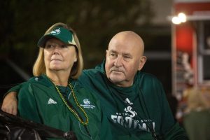 President Robert Nelsen (right) and his wife Jody (left) sitting at Hornet Stadium during Sac State homecoming football game against Northern Arizona University on Saturday, Oct. 23, 2021. Nelsen, who announced his retirement in a video featuring him and his wife, said that nobody should serve in his position for longer than eight years.