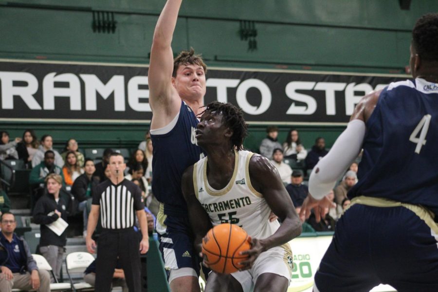 Junior forward Akol Mawein trying to convert a layup UC Merced Friday, Nov. 18, 2022 at The Nest. The Hornets took an astounding 58-43 win against the Bobcats to earn their first win at home this season.
