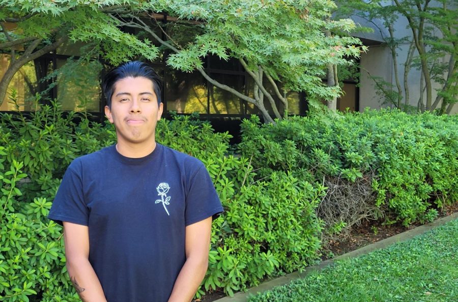 Second-year economics major Jonathan Santiago stands outside Mendocino Hall on Friday, Oct. 7, 2022. Santiago had worked as a migrant field worker for a summer like his mother but is now focused on his college education.