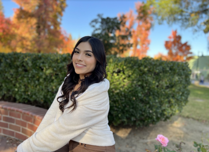 Kinesiology major Cristina Gonzalez poses across Douglass Hall on Wednesday, Nov. 16, 2022. Gonzales said she was made aware of President Nelsen’s retirement through his campus wide email.