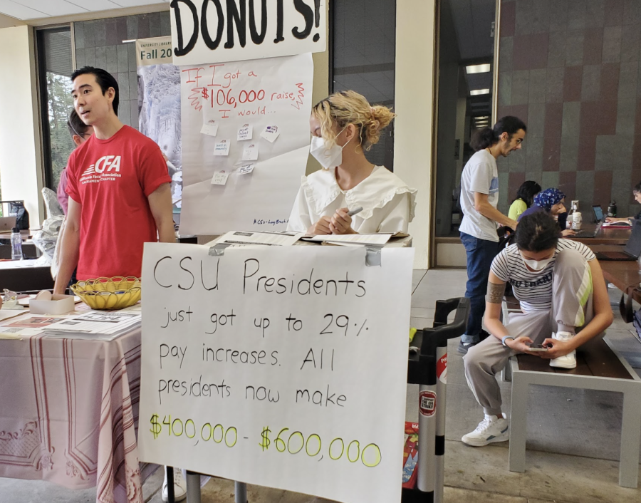 (L-R)Philosophy Lecturer and CFA Membership and Organizing Co-Chair Jonathan Chen, Assistant Art Professor Mya Dosch and Sacramento City College student Pascal Dao running a CFA awareness booth outside the Sacramento State Library Thursday, Sept. 22, 2022. The booth was meant to spread awareness on recent salary increases for the highest earners in the CSU system. 