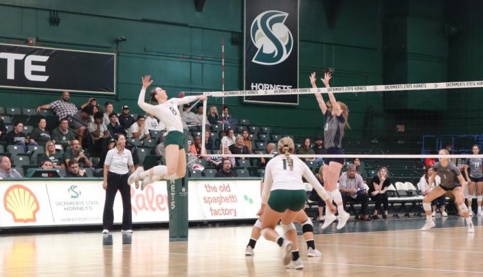 Senior Sac State volleyball outside-hitter Bridgette Smith attempting to return a ball over the net Saturday, Oct. 23, 2022, in The Nest. The Hornets are currently 14-13 on the year.