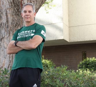 Sac State gymnastics head coach Randy Solorio stands outside of Sac State’s Athletics department on October 18, 2022. Solorio was deemed cancer free following surgery that removed his tumor and 45% of his liver in January 2022.
