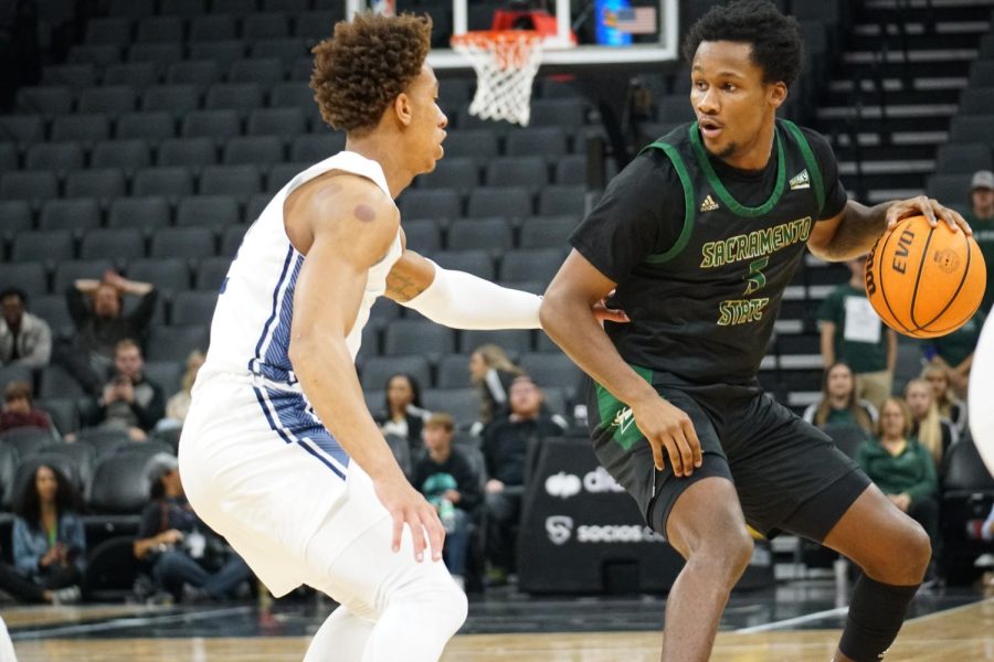 Hornets junior guard Gianni Hunt contending with  UC Davis defense Tuesday, Nov. 22, 2022, at Golden 1 Center. The Hornets dropped their fourth game in a row with a 72-65 loss against Santa Clara Saturday.

