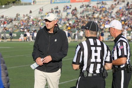 Sac State head coach Troy Taylor talks with referees on the sideline Saturday, Nov. 23, 2019, at Hornet Stadium. Taylor was reportedly named one of two finalists to become the newest Stanford head coach.
