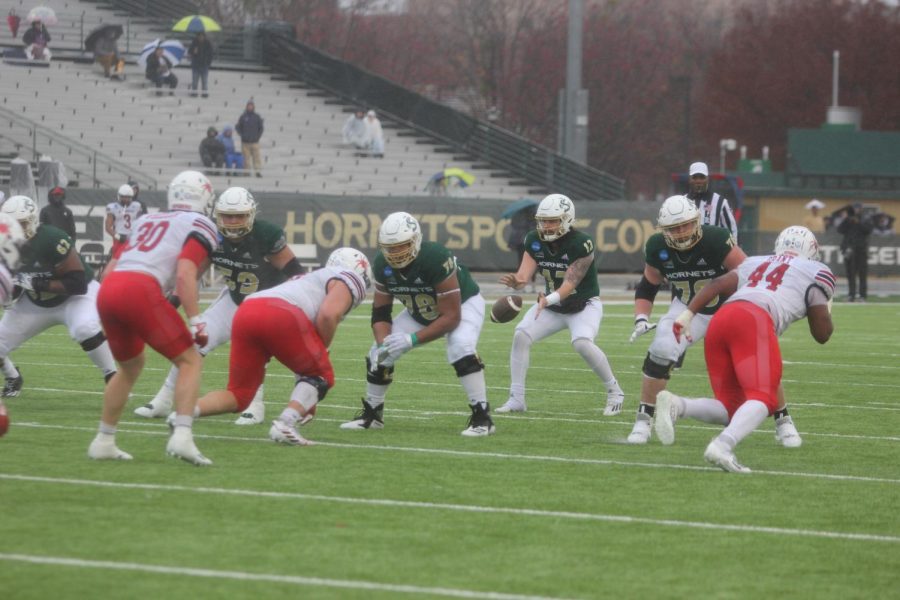 Senior quarterback Jake Dunniway receives a snap as the offensive line begins to block against Richmond on Saturday, Dec. 3, 2022, at Hornet Stadium. Dunniway threw for a season high 317 yards to propel the Hornets over the Spiders.
