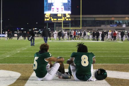 (L-R) Sophomore wideouts Devin Gandy and Jared Gipson sit solemnly reflecting on the final scoreboard, Saturday, Dec. 10, 2022. After an undefeated regular season, Sac State’s season ended 66-63 to Incarnate Word in the FCS Quarterfinal.