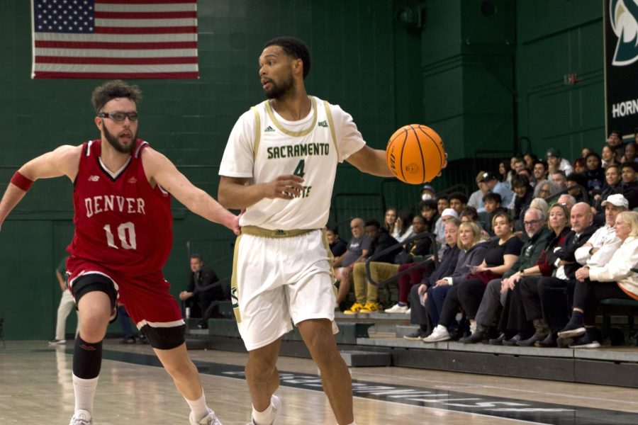 Senior Sac State guard Zach Chappell bringing up the ball against Denver Wednesday, Dec. 7, 2022, in The Nest. The Hornets snapped their four-game losing streak with a thrilling 87-85 overtime win against the Pioneers behind Chappell’s 24 points and game-winning layup.
