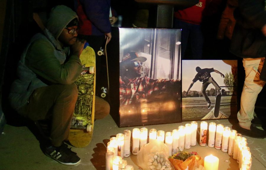 A Sacramento resident and friend of Tyre Nichols kneels down in front of a heart made of candles during a vigil in North Natomas Monday, Jan 30, 2023. Nichols’ death has resulted in protests regarding police brutality nationwide.  