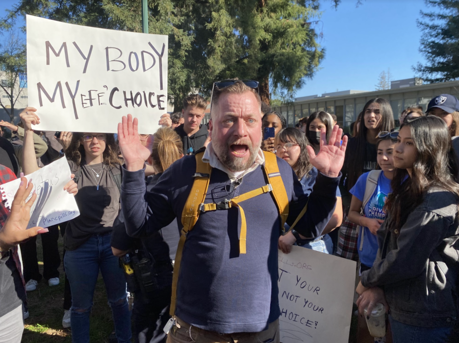 An individual rallied with students about his beliefs and religious ideologies at the library quad on Monday, Feb. 13, 2023. This incident started after Project Truth, an anti-abortion group, was on campus.