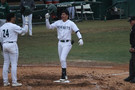 Freshman shortstop Wehiwa Aloy and Junior designated hitter Cesar Valero celebrate Aloy’s first collegiate home run at John Smith Field Saturday, Feb. 25, 2023. Aloy spearheaded the offense over the weekend with five hits, five RBIs, two HRs, one double and one triple.